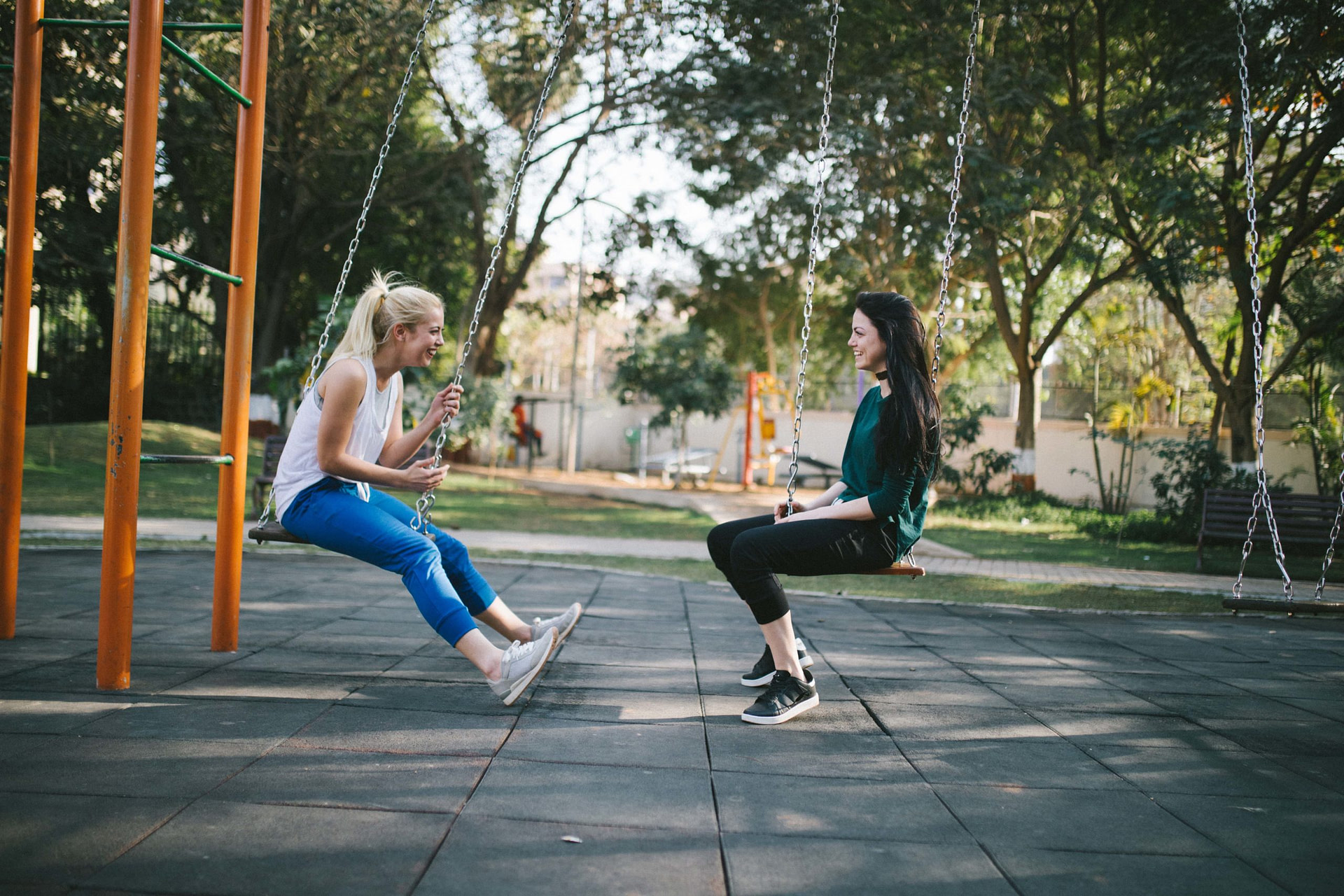 Two girls on swings