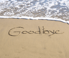 goodbye written in the sand on the shore line!