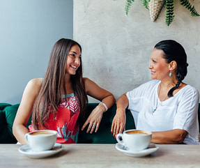 Mother and daughter communication with coffee.