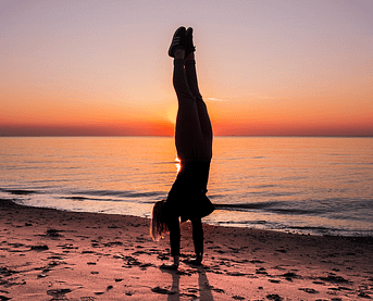 handstand on the beach