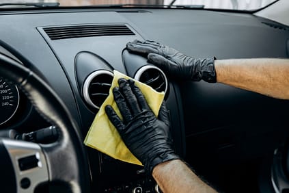 A,Man,Dusts,The,Inside,Of,A,Car,With,Microfiber Auto Detailer, Detailing, Dashboard, Wash, Microfiber, Sports Car, Auto Detail, Fort Collins, Loveland, Longmont