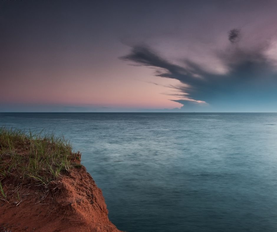 View of an ocean expanse and purple sky