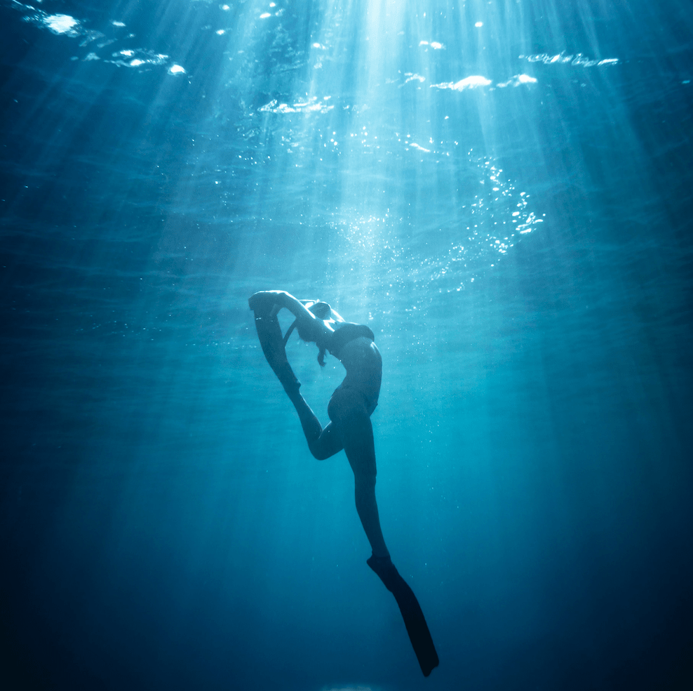 scuba diver in a yoga pose